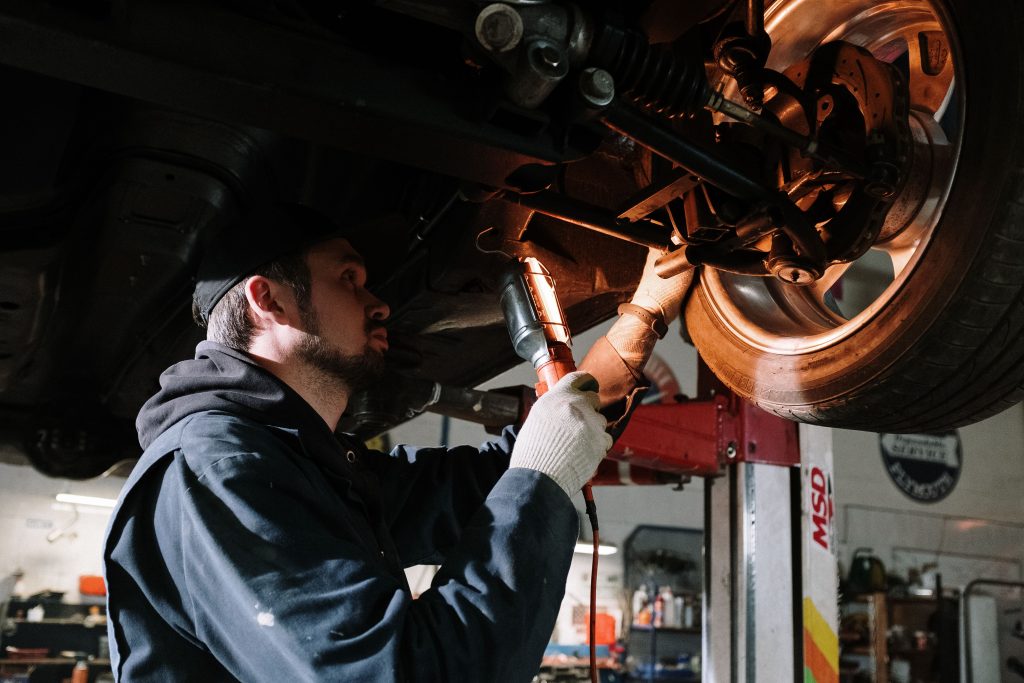 Automotive technician servicing a customer's vehicle