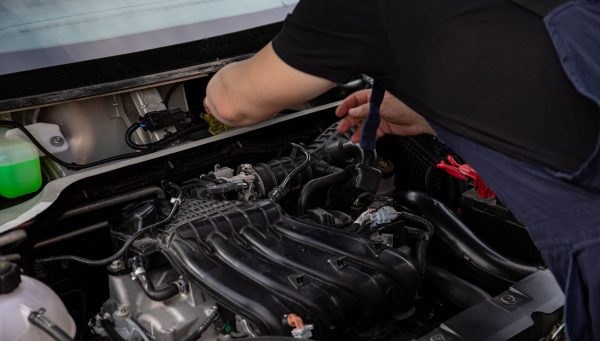 Auto repair technician identifying recommended repairs for a customer estimate {{brizy_dc_image_alt imageSrc=