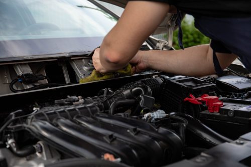 Auto Repair Software Evaluation Auto repair technician performing vehicle service in a productive repair shop