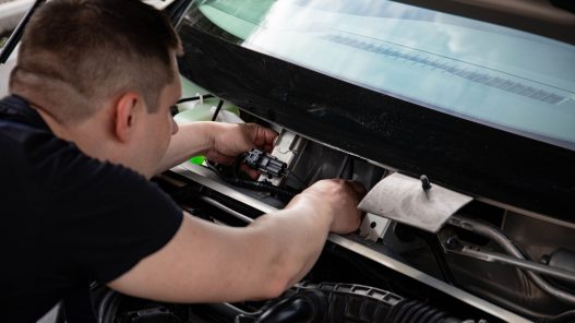 Auto repair technician using parts tied directly to a repair order workflow