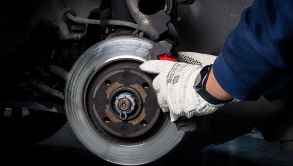 Auto repair technician completing approved repair work to support faster cash flow