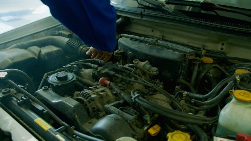 Auto repair technician performing a vehicle inspection to identify recommended repairs