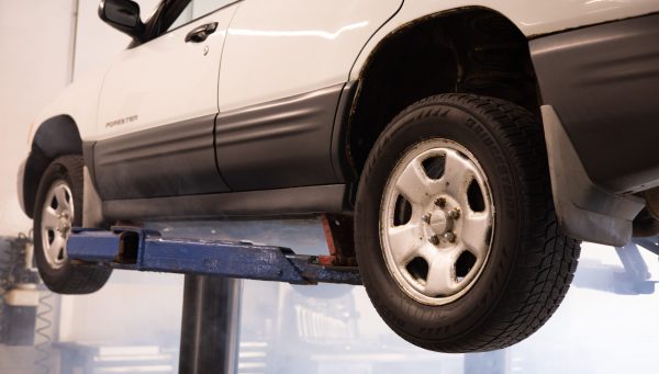 Profit-Focused Shop Performance Vehicle on a service lift in a productive auto repair shop